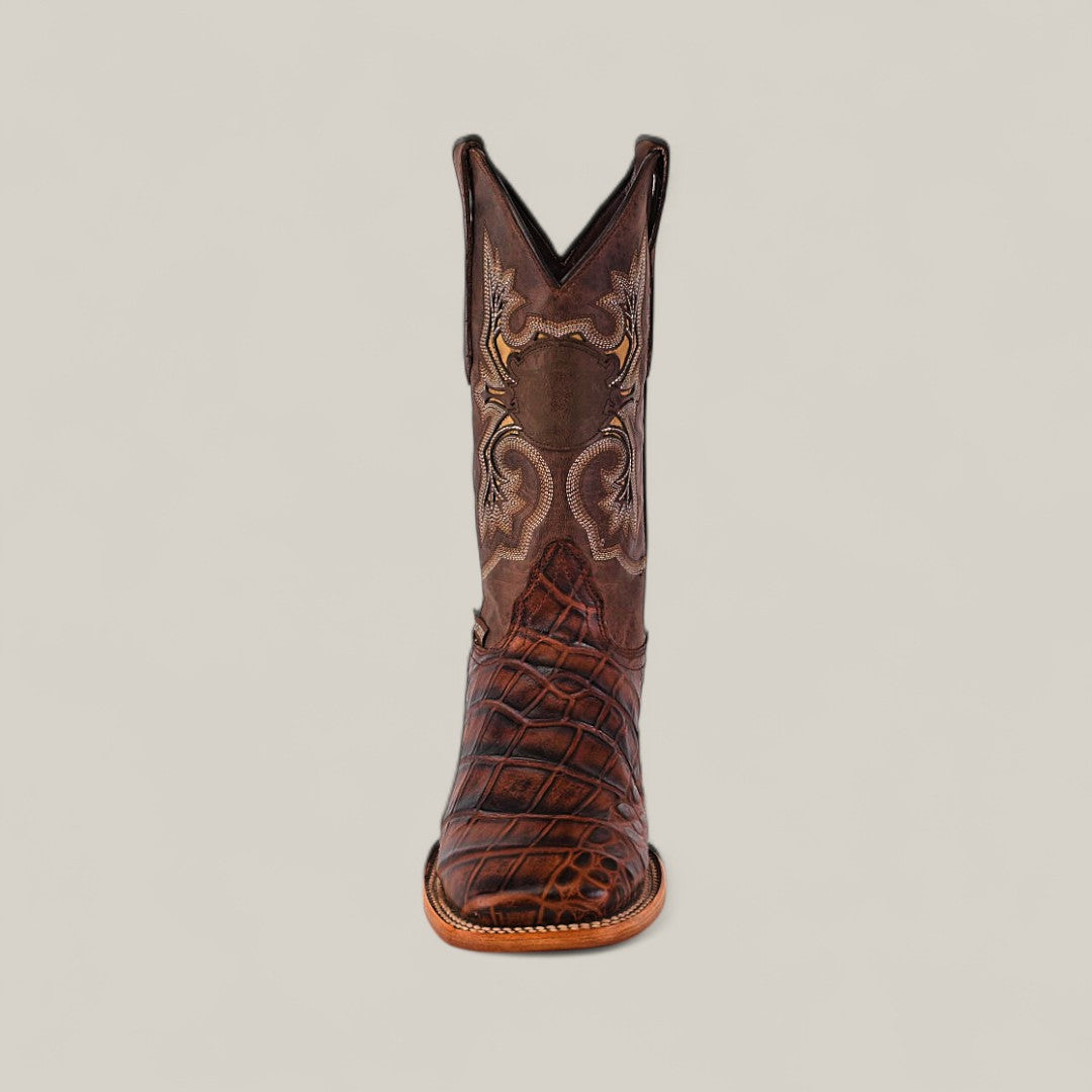 The Jonh - Brown - Square Toe is a single premium leather cowboy boot with intricate stitching and a textured pattern, shown from the front against a plain light background.