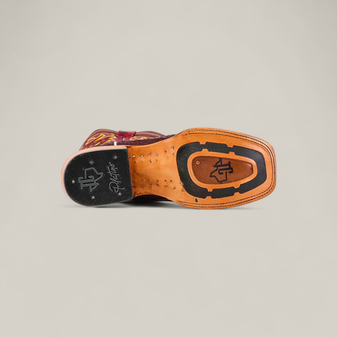 The image shows the sole of the Exotic Python - Blackcherry - Square Toe boot. It features a square toe, brown leather, and a black rubber sole with stitched details and decorative branding on a plain background.