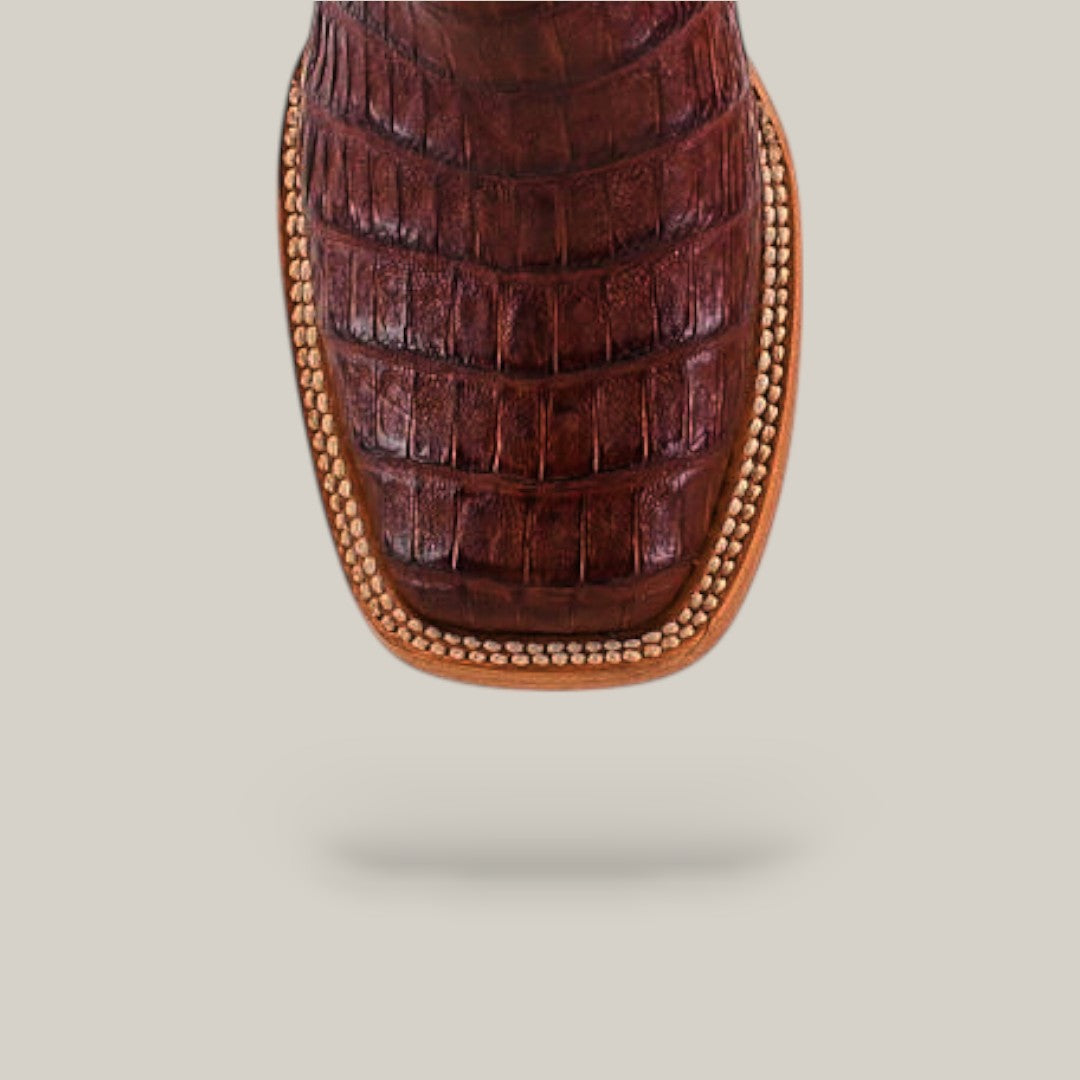 Close-up of the toe on Exotic Caiman Belly Tail Cognac Square Toe Kids Boots, featuring detailed stitching and a textured caiman belly pattern.