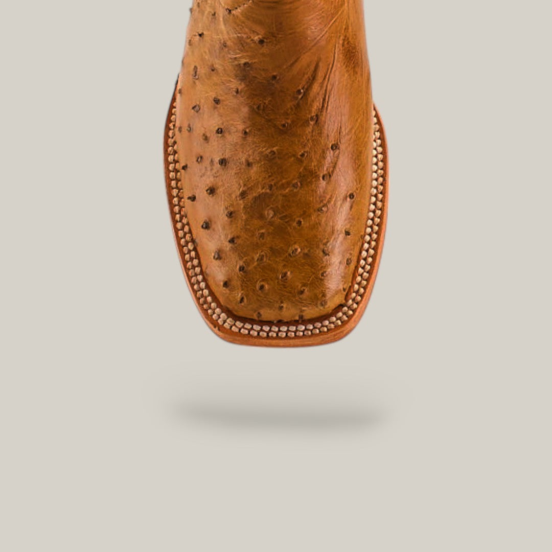 Close-up of Exotic Full Quilt Ostrich Fawn - Square Toe - Kids Boots, crafted from luxurious ostrich leather with a square toe and decorative edge stitching, set against a plain light background for classic Western style.