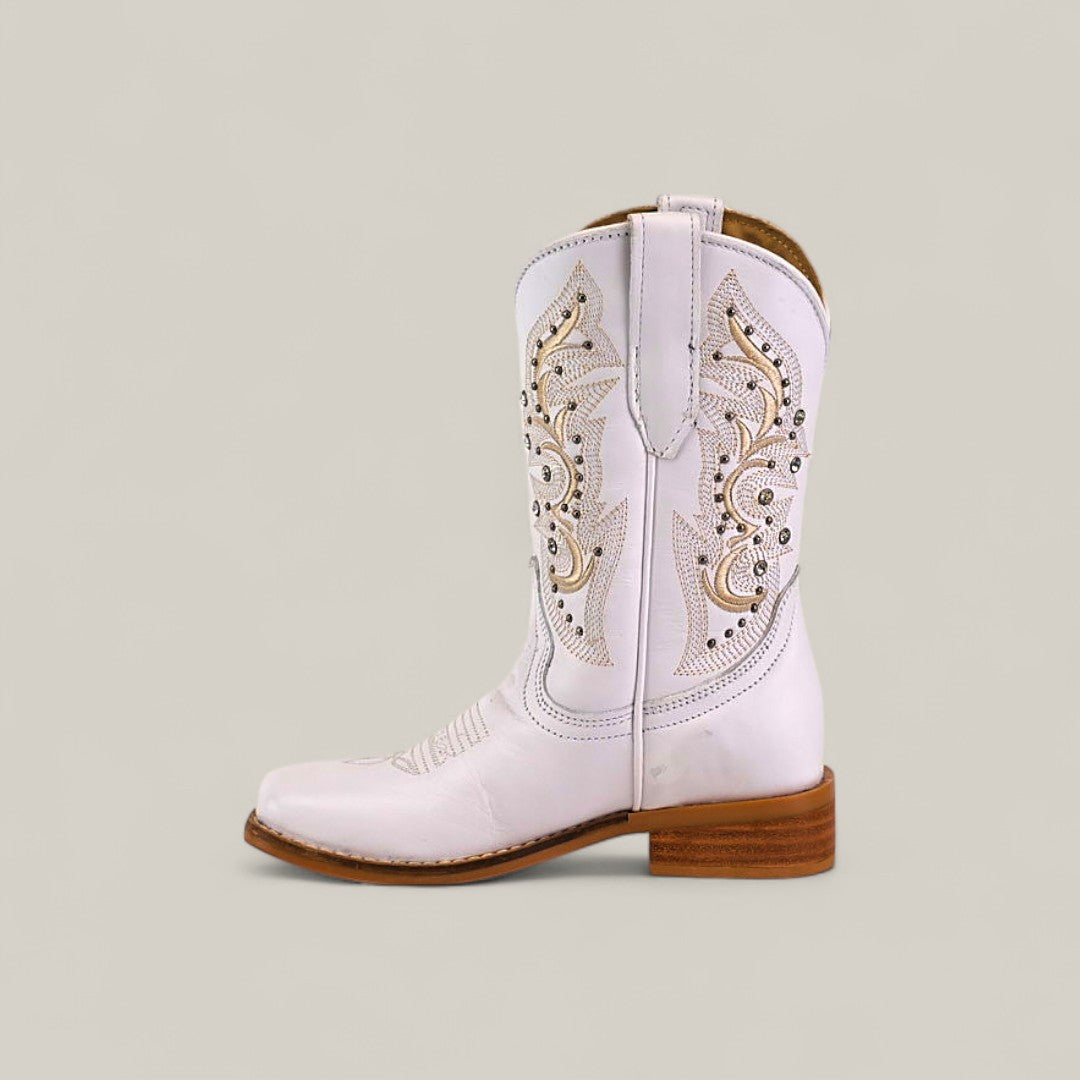 The Amara White - Square Toe Kids Boots are premium white cowboy boots with decorative stitching, cutout details, a low brown stacked heel, and a comfortable pointed toe—perfect for stylish kids.
