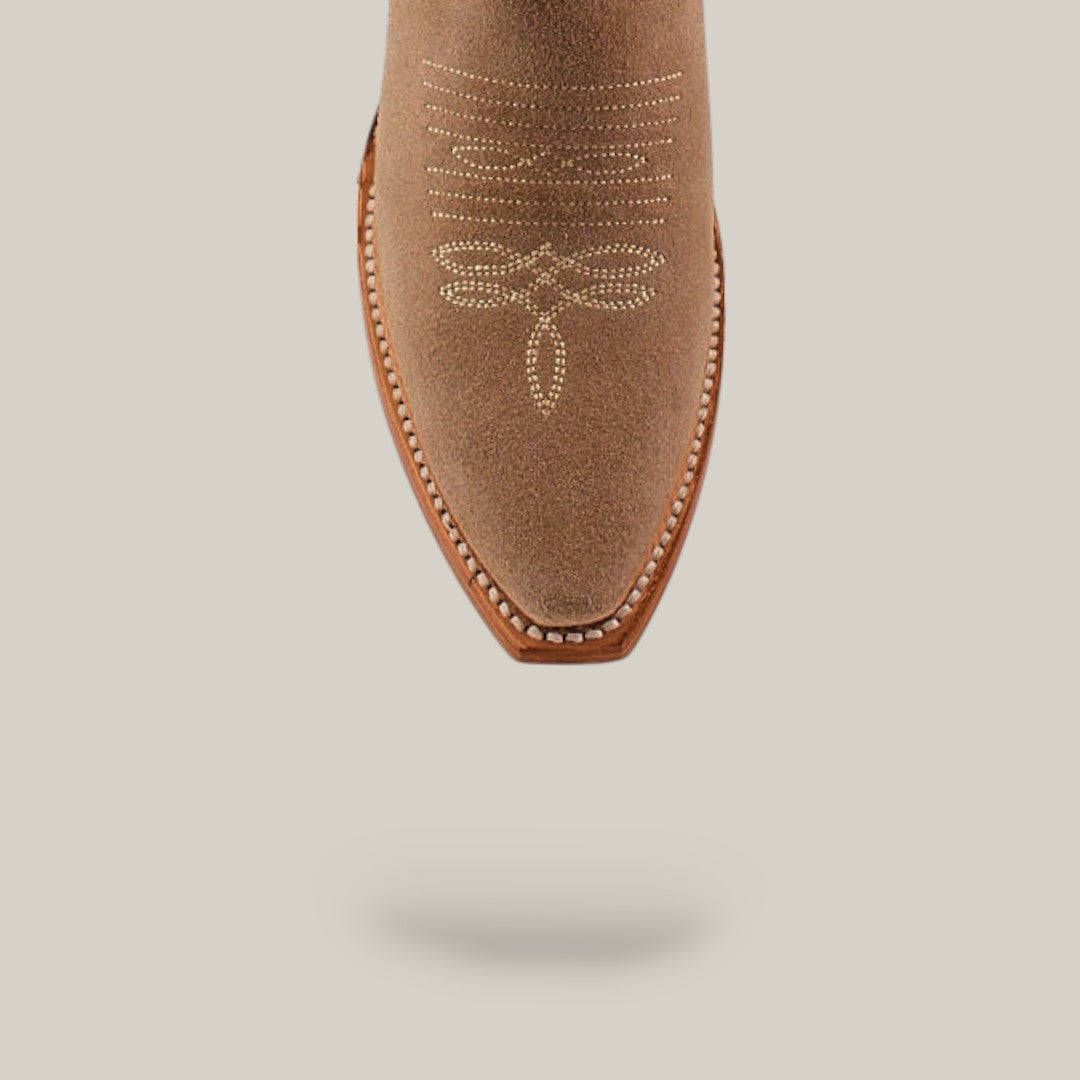 A Miranda Suede Khaki Boot with leather sole and snip toe, featuring decorative white stitching, photographed from above on a light beige background.