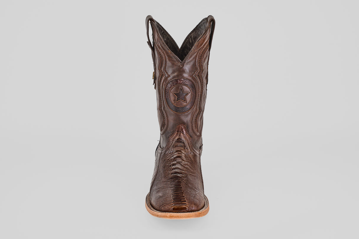 The Austin Leg - Brown - Square Toe is a single brown western boot with decorative stitching, a star emblem on the front, and a light-colored sole, photographed on a plain white background.