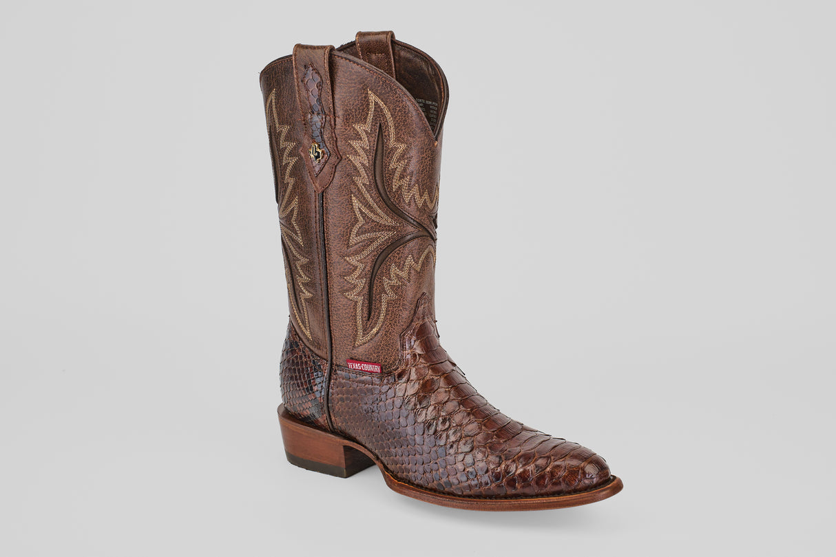 A single Tanner - Brown - Round Toe cowboy boot with a textured Python Cafe Oval lower, decorative stitching on the upper shaft, and a low wooden heel, shown on a plain white background.