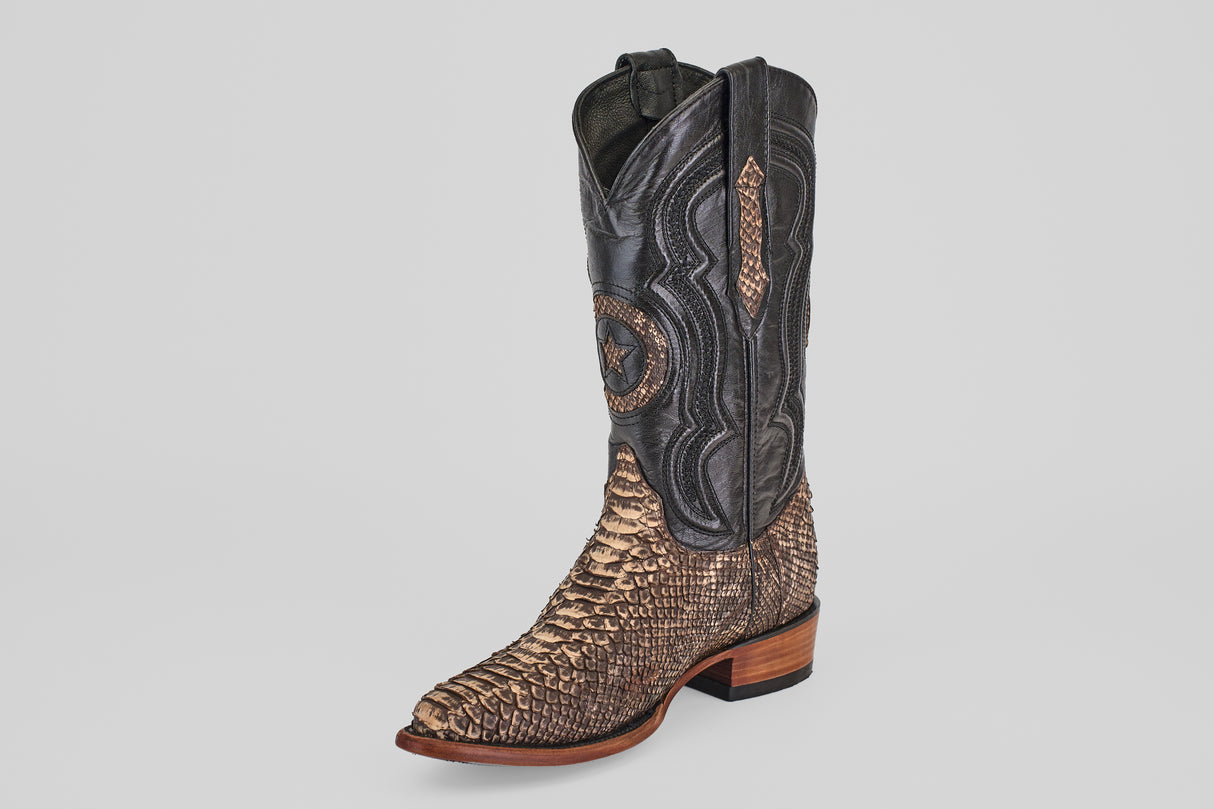 The Tanner – Rustic Bone – Snip Toe boot features a western design with a dark brown leather upper, tan python-textured leather lower and snip toe, decorative stitching, and a wooden heel, shown on a plain light background.