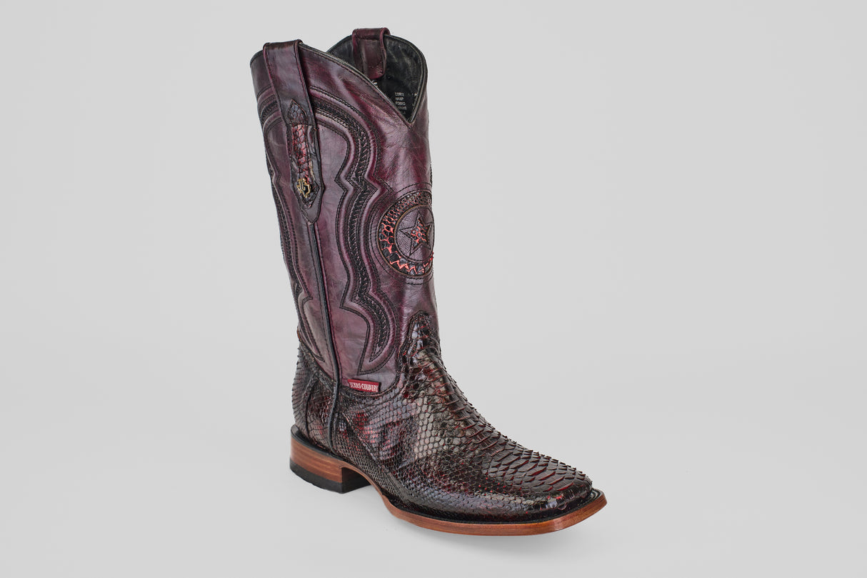 The Tanner - Black Cherry - Square Toe is a tall cowboy boot in burgundy with intricate stitching and a textured Python Blackcherry snakeskin foot, shown against a plain white background.
