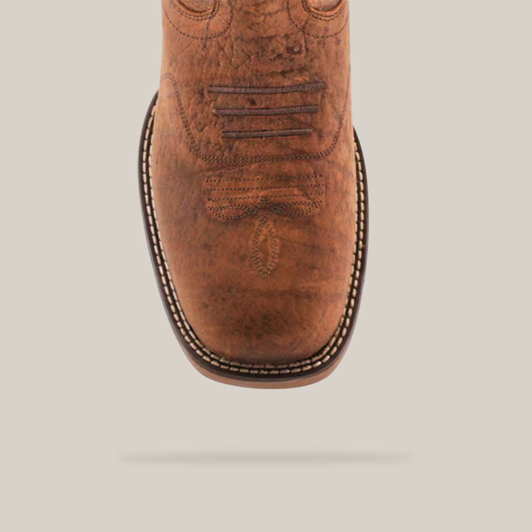 Close-up of the Tan Brown Rough out - Waterproof - Soft Toe boot featuring intricate toe cap stitching. This handcrafted design includes a square toe, patterned sole with white edge stitching, and premium slightly distressed cowhide leather.