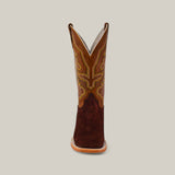 Front view of a Brown Suede - Platinum boot, featuring a square toe, crafted with rich brown leather and detailed stitching on the shaft against a plain grey background.