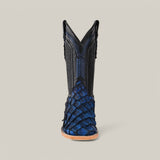 Front view of the Exotic Pirarucu Fish - Dark Blue Square Toe boot, featuring a textured lower half reminiscent of fish scales and a black upper with decorative stitching, set against a neutral gray background. This boot has pointed V-shaped shafts, adding an exotic touch.