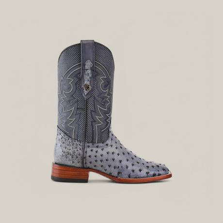 A single Exotic Full Quilt Ostrich boot in Safari Gray, crafted with a square toe and intricate shaft designs, is displayed against a plain light background.