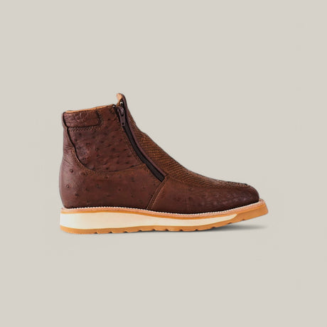 Meet the Exotic Python - Brown: a stylish leather ankle boot with a side zipper and an ostrich pattern. It features a light beige rubber sole, detailed stitching, and is perfect for fashionistas. Set against a pale background, it embodies elegance and style.