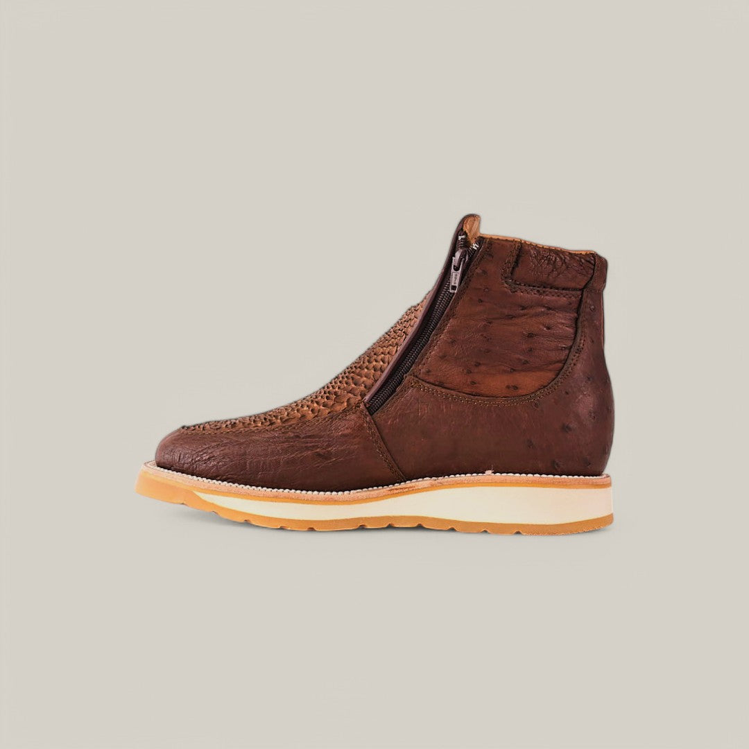 Meet the Exotic Python - Brown Ankle Boot: a textured brown leather boot with woven front, side zipper, light-colored sole with slight heel, all set on a plain light gray background. Its the perfect blend of style and sophistication.