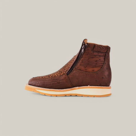 Meet the Exotic Python - Brown Ankle Boot: a textured brown leather boot with woven front, side zipper, light-colored sole with slight heel, all set on a plain light gray background. Its the perfect blend of style and sophistication.
