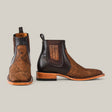 The Exotic Python - Tamarindo ankle boots are stylish Chelsea boots in brown, featuring a python-embossed leather texture, dark elastic side panels, and light brown wooden soles set against a plain gray background.