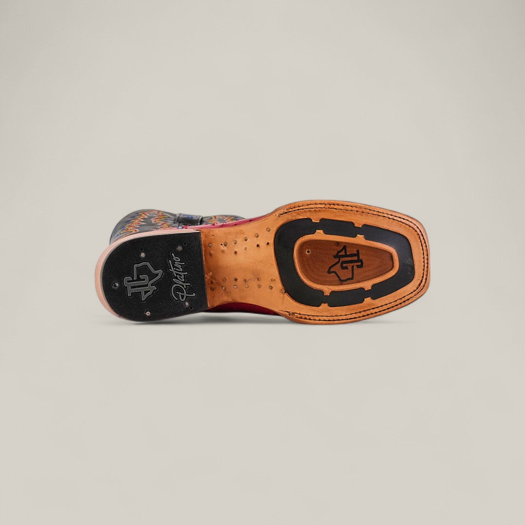 A close-up of the Exotic Full Quilt Ostrich - Red - Square Toe dress shoe sole shows its branded logo, square toe design, and intricate patterns in black and tan leather, set against a plain light background.