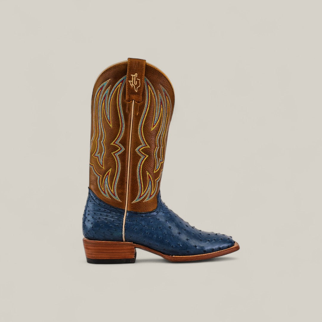 The Exotic Full Quilt Ostrich - Blue - Square Toe features a brown stitched shaft, textured blue ostrich leather foot, wooden heel, and stylish yellow and white stitching from the Platinum Collection.