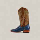 The Exotic Full Quilt Ostrich - Blue - Square Toe from the Platinum Collection features a blue quilted ostrich leather foot, brown shaft with yellow stitching, and wooden heel, displayed in profile on a light background.