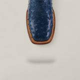 Top view of the Exotic Full Quilt Ostrich - Blue - Square Toe boot, highlighting its stylish square toe and tan welt stitching on a light gray background. The blue ostrich boot casts a soft shadow below.