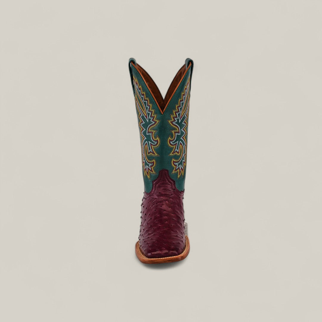 The Exotic Full Quilt Ostrich - Wine - Square Toe boot features a textured burgundy foot, tall green shaft, and intricate yellow-blue stitching—part of the Platinum Collection—displayed against a plain, light background.