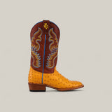 The Exotic Full Quilt Ostrich - Buttercup - Square Toe boot features a yellow ostrich leather foot, a brown shaft with blue and yellow stitching, square toe style, brown heel, and a yellow logo near the top.
