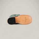 The Exotic Full Quilt Ostrich Gray - Square Toe - Kids Boots feature a light tan ostrich leather sole with stitched edges, black rubber heel, and a blue and green patterned upper that showcases western style.