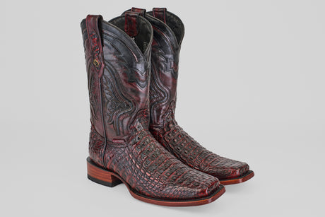 A pair of Exotic Caiman Hornback - Blackcherry - Rodeo Toe boots with intricate shaft stitching and a textured reptile finish, shown on a light gray background.