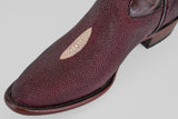 A close-up of the Ranger – Wine – Round Toe boot in burgundy textured leather, featuring a unique oval-shaped lighter patch near the toe, shown against a plain light background.