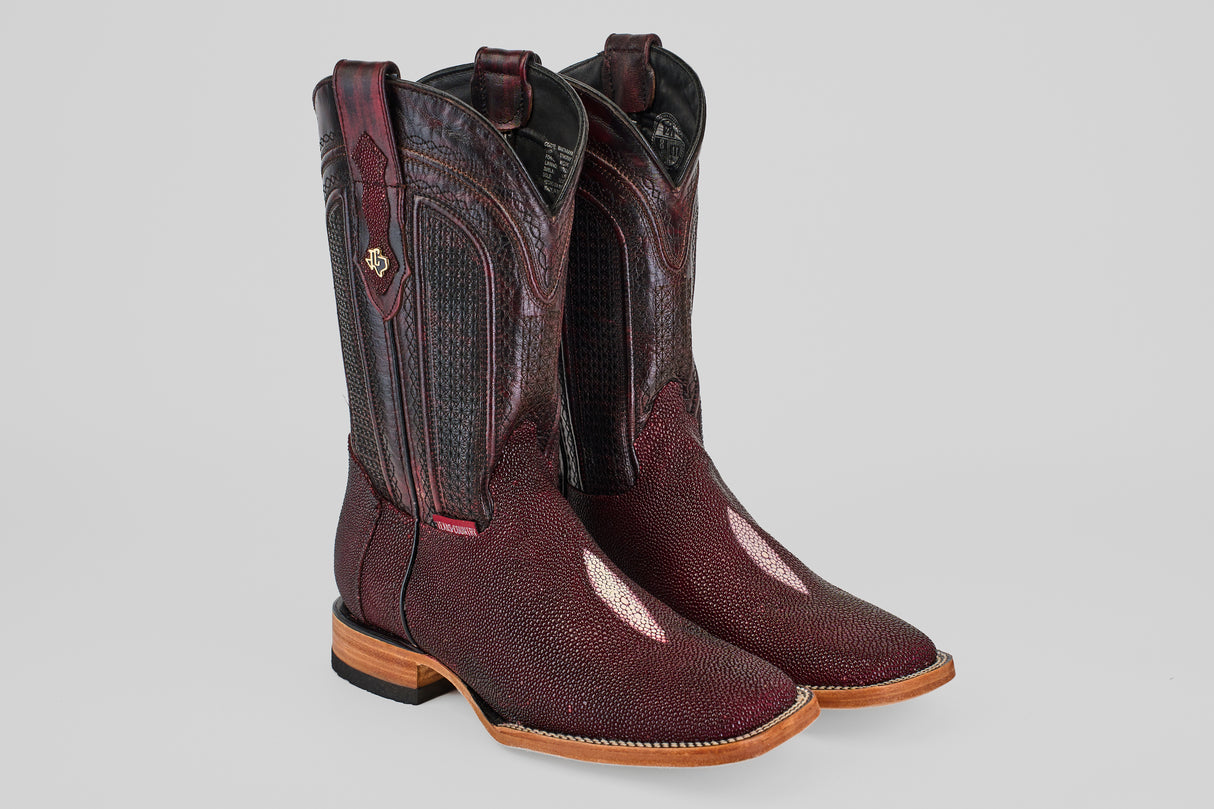 The Ranger – Wine – Square Toe boots feature tall, dark red textured leather, intricate stitching, light brown soles, and side pull straps, shown on a light grey background.
