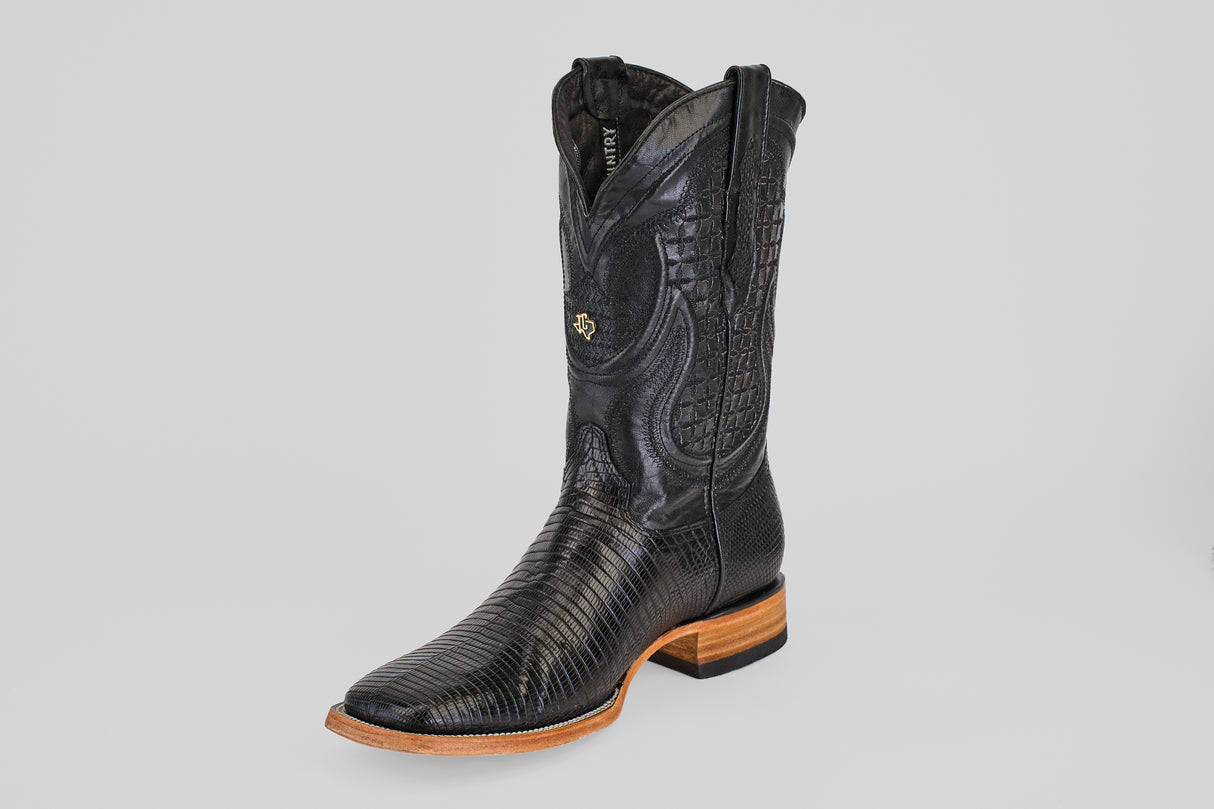 The Blaze – Black – Square Toe cowboy boot is made from genuine lizard leather with a textured pattern and a light brown wooden sole, shown on a plain white background.