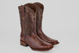 A pair of Blaze – Brown – Rodeo Toe cowboy boots crafted from genuine lizard leather with decorative stitching, a textured finish, square toes, and low stacked heels, displayed side by side on a plain light background.