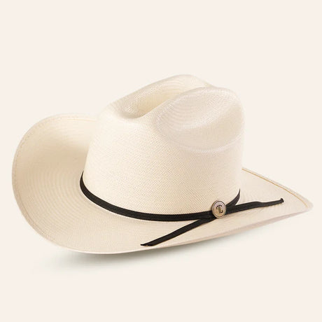 The 30x Sinaloa Straw Hat features a wide brim and black band for excellent sun protection. With a small round metal accent, this light-colored cowboy hat is perfect for outdoor adventures and is set against a plain light background.