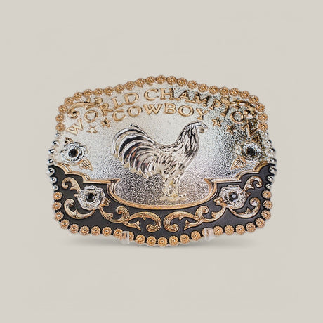 The Square Champion Rooster Buckle features a gold rooster at its center, surrounded by ornate western designs. World Champion Cowboy is engraved at the top, with intricate gold and alpaca silver detailing throughout.