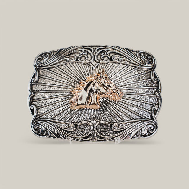 The Square Gold Rose Horse Buckle showcases an embossed horse head at its center with ornate swirling western designs and a radiating background, crafted from alpaca silver to exude rugged elegance in Texas-style.