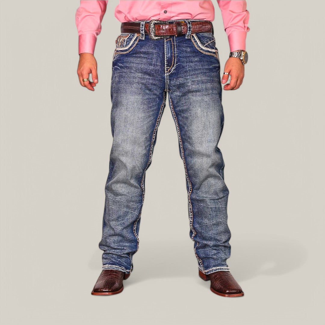 A person in a pink long-sleeve shirt and Western Blue Straight Fit Embroidered Jeans WJ-2348 stands against a plain background. Paired with a brown belt and cowboy boots, the flattering fit emphasizes their stylish ensemble.