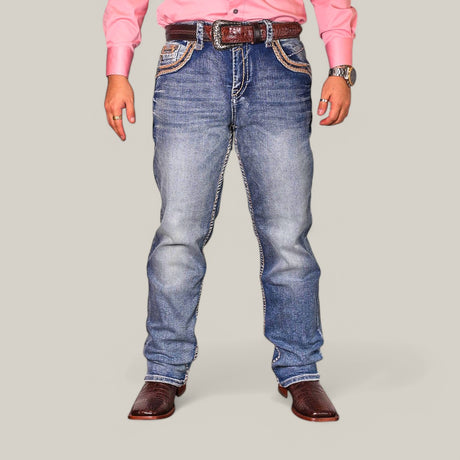 A person wearing a pink long-sleeve shirt and Western Blue Straight Fit Embroidered Jeans WJ-2347, accompanied by a brown belt and cowboy boots, stands against a plain background with hands relaxed by their sides.