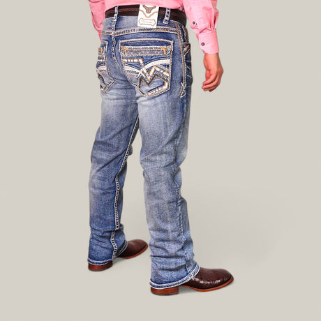 A person wearing a pink shirt, brown cowboy boots, and Western Blue Straight Fit Embroidered Jeans WJ-2347 stands against a plain background.