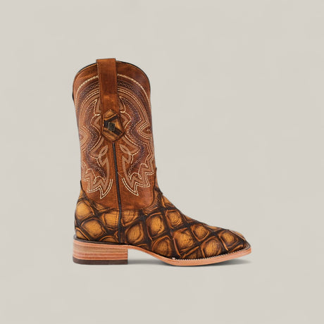 The Big Bass Pirarucu Print Rustic Honey - Square Toe boot features detailed stitching on the upper shaft and a textured scale-like pattern on the lower, displayed from the side against a plain light background.