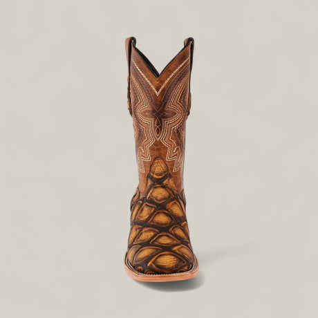The Big Bass Pirarucu Print Rustic Honey - Square Toe boot features a brown, scale-textured foot with white stitching and is shown facing forward on a plain beige background.