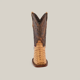 A single Exotic Caiman Hornback - Antique - Rodeo Toe boot with a woven tan leather toe and detailed dark brown shaft, featuring decorative stitching, displayed on a plain white background.
