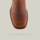 Close-up of the handcrafted Rustic Turquoise Brown boot featuring decorative stitching. It showcases a square toe and stitched welt, highlighting detailed craftsmanship with premium cowhide leather, set against a plain background.