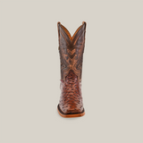 The Exotic Ostrich - Brown - Rodeo Toe boot showcases superior craftsmanship with intricate stitching and patterns on the shaft. The textured design on the toe enhances its artisanal beauty, standing centered on a plain white background.