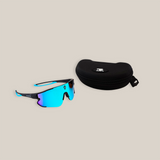 The DR Sport Sunglasses Frost Blue with a modern design feature blue-tinted lenses and black frames alongside a sleek black zippered carrying case. Both have a subtle logo, offering UV protection and standing out beautifully against the plain white background.
